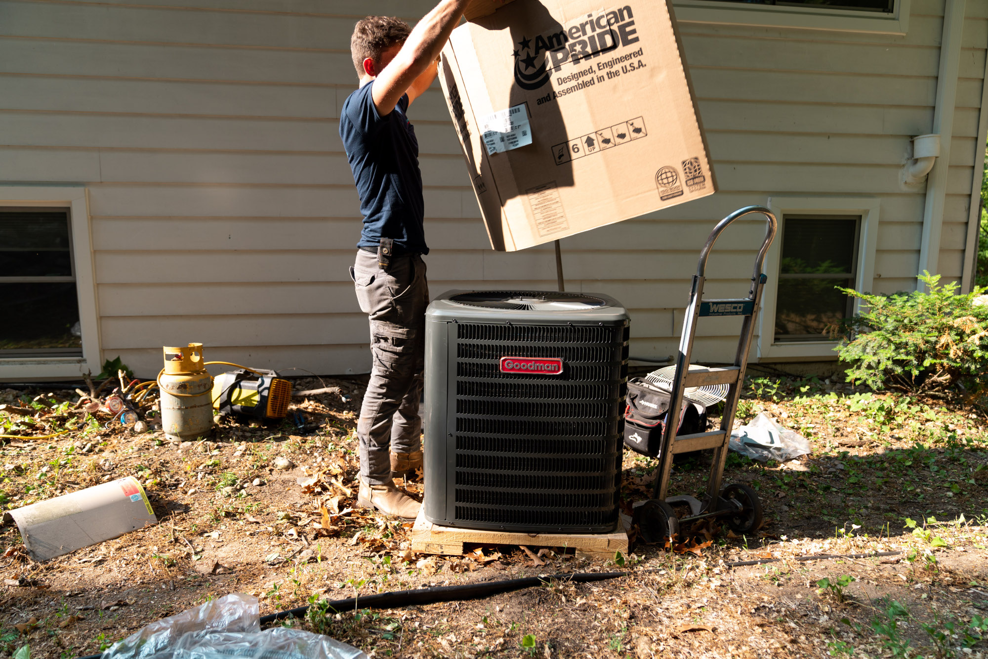 A Fleetwood's technician prepares an AC unit for installation.